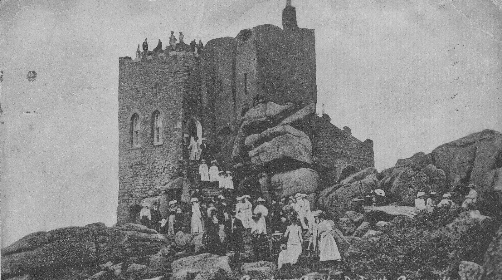 carn brea castle with people